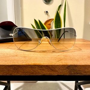 White rim, sporty ray bans.